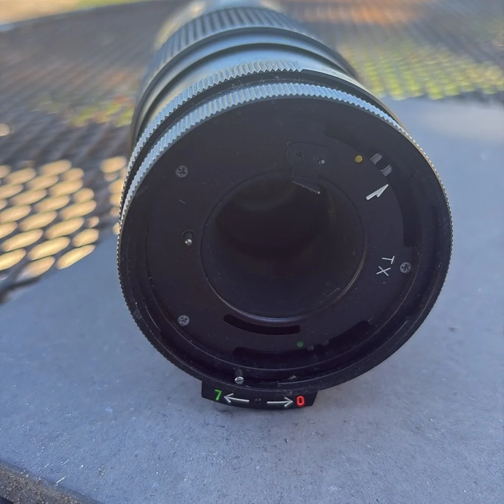 The image shows a Vivitar 300mm 1:5.6 lens. Additional information: